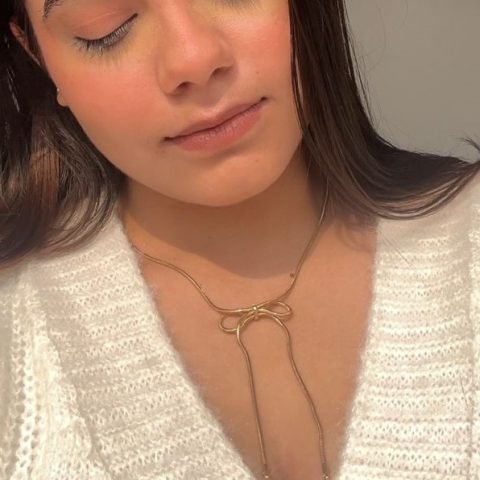 Golden Bow Pendant, worn