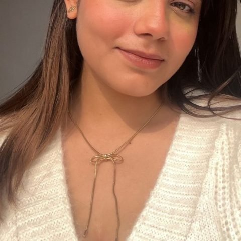 Golden Bow Pendant, worn