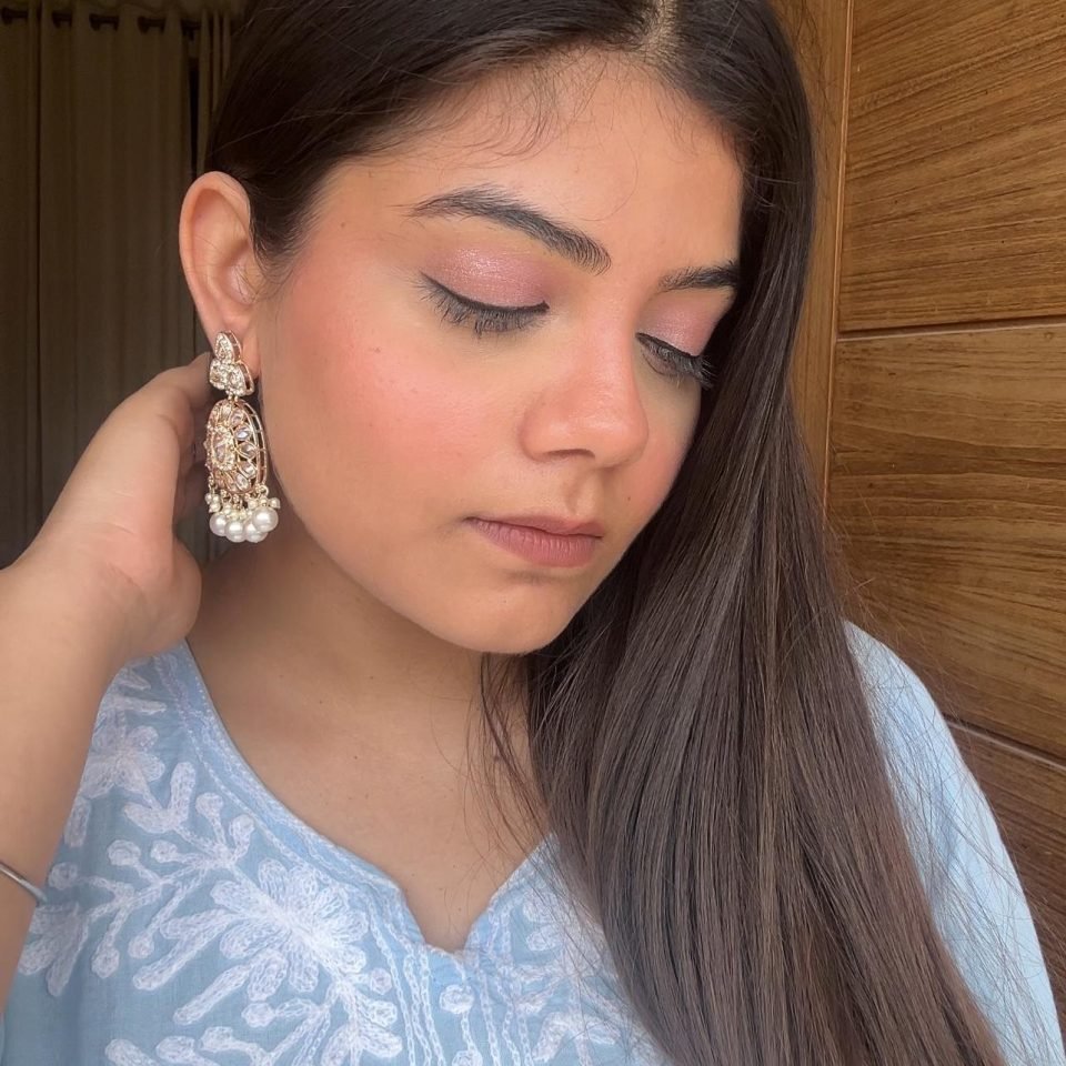 Pearl-White Kundan Teardrop Jhumkas, worn